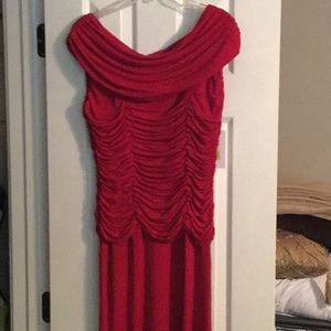 Red crepe wide shoulder party dress.